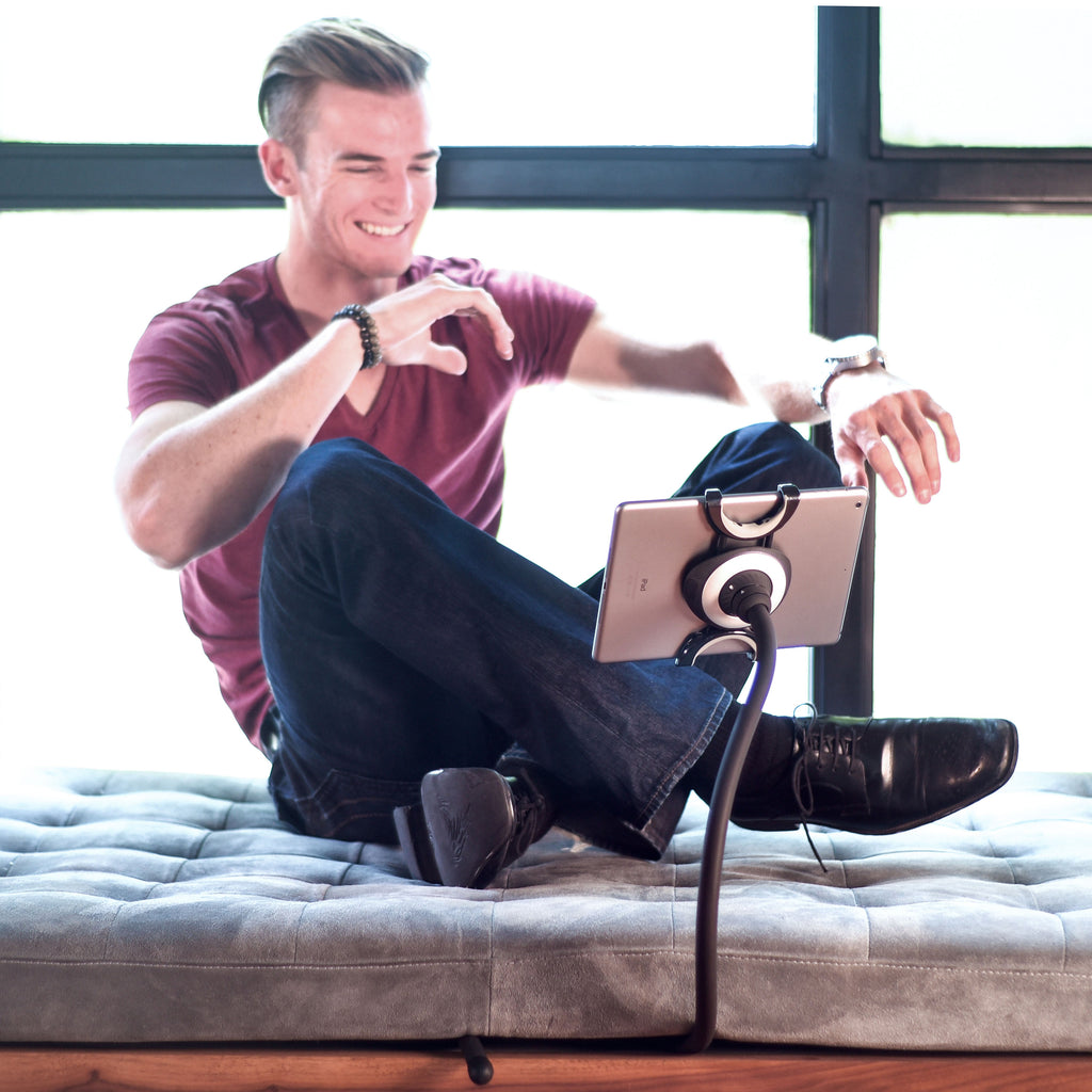 Spider Monkey flexible tablet stand beside a couch